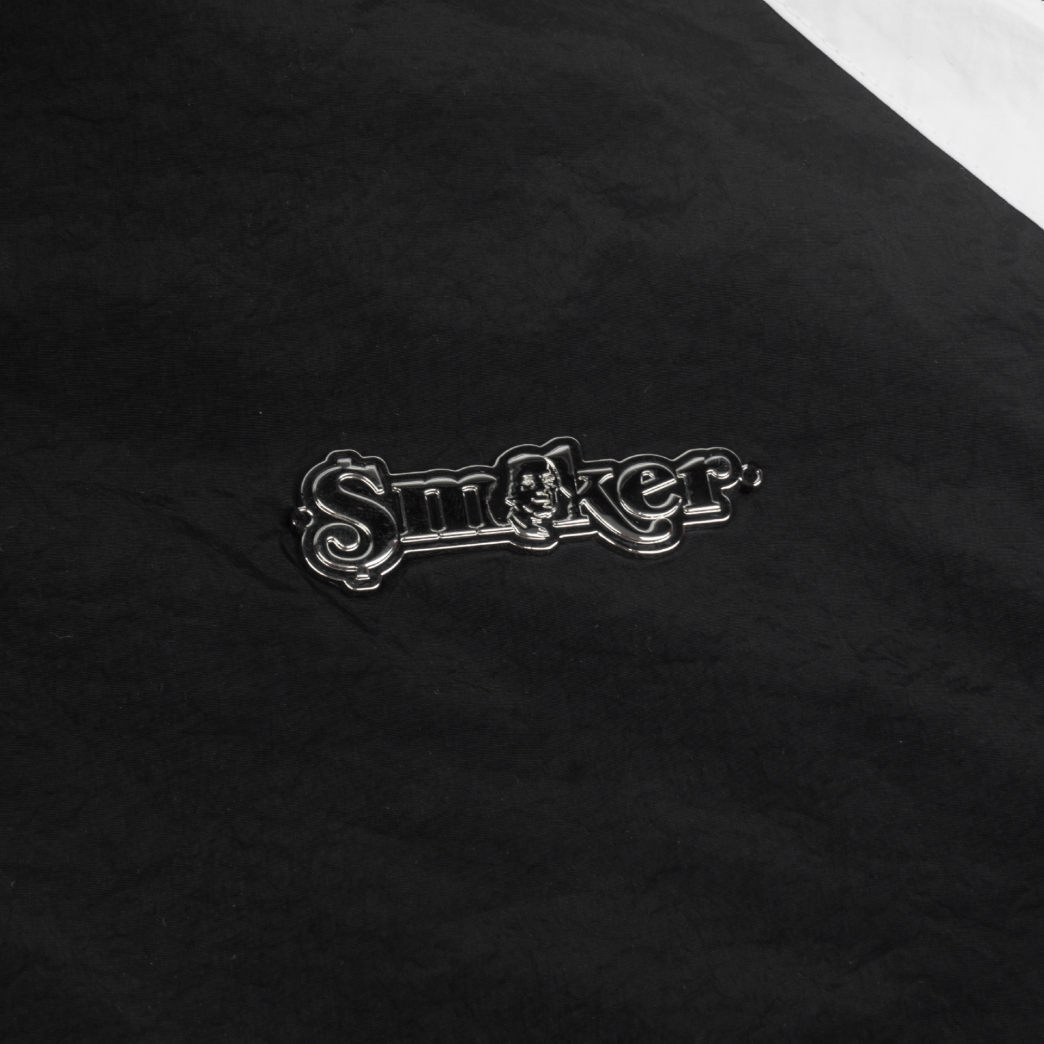 METAL LOGO WINDBREAKER NYLON JACKET IN BLACK